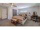 Bright primary bedroom features a ceiling fan, shutters, and neutral tones at 6909 Farris Dr, Lakeland, FL 33811