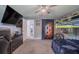 Bedroom with a bunk bed, TV, gray carpet, and a ceiling fan at 6909 Farris Dr, Lakeland, FL 33811