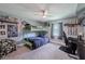 bedroom with bunk beds, a ceiling fan, sports memorabilia, and a gray carpet at 6909 Farris Dr, Lakeland, FL 33811