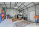 A large versatile garage featuring storage and workspace, offering great potential for various hobbies and projects at 6909 Farris Dr, Lakeland, FL 33811
