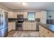 Modern kitchen featuring stainless steel appliances, granite countertops, and stylish backsplash at 6909 Farris Dr, Lakeland, FL 33811