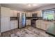 Beautiful kitchen with island, stainless steel appliances, and abundant storage in white cabinets at 6909 Farris Dr, Lakeland, FL 33811