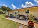 Outdoor patio with comfortable seating, potted plants, and grill perfect for entertaining at 6909 Farris Dr, Lakeland, FL 33811