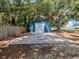 Backyard shed with basketball hoop, providing both storage and recreational space at 6909 Farris Dr, Lakeland, FL 33811