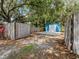 Backyard shed with a concrete pad, offering ample storage space and a basketball hoop at 6909 Farris Dr, Lakeland, FL 33811
