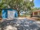 Backyard shed with basketball hoop, providing storage and recreation space at 6909 Farris Dr, Lakeland, FL 33811