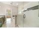 Elegant bathroom featuring a glass shower and soaking tub with natural light at 9349 Mira Valle Ln, Winter Garden, FL 34787