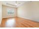 Spacious bedroom offers a tray ceiling, ceiling fan, and large windows at 9349 Mira Valle Ln, Winter Garden, FL 34787
