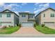 Modern two-story home features a brick driveway and a gray color scheme at 9349 Mira Valle Ln, Winter Garden, FL 34787
