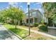 Beautiful two-story home with a front porch and lush landscaping at 9349 Mira Valle Ln, Winter Garden, FL 34787