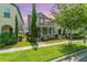 Charming two-story home with well-manicured lawn and inviting front porch with decorative columns at 9349 Mira Valle Ln, Winter Garden, FL 34787