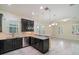 Well-lit kitchen features granite countertops, stainless steel appliances, and ample cabinet space at 9349 Mira Valle Ln, Winter Garden, FL 34787