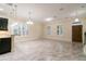 Bright living room with modern finishes, large windows, and a doorway to the front entrance at 9349 Mira Valle Ln, Winter Garden, FL 34787