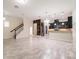 Spacious living area features staircase, tile floors, and a chef's kitchen with pantry at 9349 Mira Valle Ln, Winter Garden, FL 34787