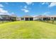 Large, well-maintained backyard with lush green grass and a black metal fence at 2132 Limestone Trl, Kissimmee, FL 34747