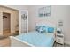 Charming bedroom featuring coastal-themed decor and adjacent sitting room at 2132 Limestone Trl, Kissimmee, FL 34747