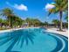 Large community pool with lounge seating and mature landscaping provides a relaxing outdoor retreat at 2132 Limestone Trl, Kissimmee, FL 34747