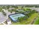 Overhead view of well-maintained community tennis courts surrounded by lush landscaping at 2132 Limestone Trl, Kissimmee, FL 34747