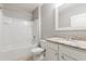 Full bathroom featuring a shower over bath, vanity with granite countertops, and tiled floors at 3079 Bethpage Loop, Mount Dora, FL 32757