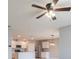 Spacious living room featuring an open-concept design and plenty of natural light from multiple light fixtures at 3079 Bethpage Loop, Mount Dora, FL 32757
