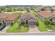 Aerial view of home highlighting the tile roof, landscaping, and surrounding neighborhood at 4235 Prima Lago Dr, Lakeland, FL 33810
