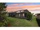 Enjoy this home's serene backyard featuring a screened-in lanai perfect for outdoor relaxation and entertaining at 4235 Prima Lago Dr, Lakeland, FL 33810