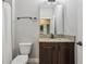 Bathroom features granite counters, dark wood cabinetry, and a shower and tub combo at 4235 Prima Lago Dr, Lakeland, FL 33810