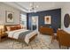 Beautiful bedroom with a tray ceiling, stylish decor, and neutral tones throughout at 4235 Prima Lago Dr, Lakeland, FL 33810