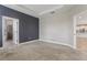 Spacious bedroom with large doorway and open access to the bathroom at 4235 Prima Lago Dr, Lakeland, FL 33810