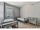 This bedroom includes two twin beds and features a decorative accent wall at 4235 Prima Lago Dr, Lakeland, FL 33810