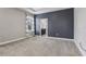 Spacious bedroom featuring plush carpeting, a neutral color palette, and natural light from a window at 4235 Prima Lago Dr, Lakeland, FL 33810