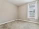 Bedroom featuring carpet, neutral paint, baseboard trim, and natural light at 4235 Prima Lago Dr, Lakeland, FL 33810