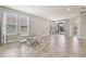 Bright dining area features tile floors, large windows and access to the outdoor living space at 4235 Prima Lago Dr, Lakeland, FL 33810