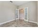 Flex room featuring double doors, tile floors, and neutral paint at 4235 Prima Lago Dr, Lakeland, FL 33810