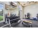 Gym featuring weight machines, free weights, wall mirrors and lots of natural light for an energizing workout at 4235 Prima Lago Dr, Lakeland, FL 33810