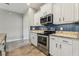 Well-equipped kitchen with granite counters, stainless steel appliances, and ample cabinet space at 4235 Prima Lago Dr, Lakeland, FL 33810