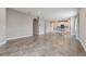 Bright and airy living room with tile floors and views of the adjacent kitchen at 4235 Prima Lago Dr, Lakeland, FL 33810