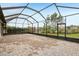 Large, screened-in patio with brick flooring overlooking the backyard at 4235 Prima Lago Dr, Lakeland, FL 33810