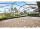 Large screened patio area with brick pavers, offering a perfect outdoor living space and relaxing environment at 4235 Prima Lago Dr, Lakeland, FL 33810