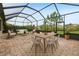 Covered patio featuring living and dining furniture, with a view of the yard at 4235 Prima Lago Dr, Lakeland, FL 33810