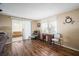 Inviting living room with sliding glass doors, plenty of light, and a cozy atmosphere, creating a comfortable and versatile space at 932 Cassandra Ln, Lakeland, FL 33809