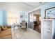 Comfortable living space featuring tile floors, light blue walls, and sliding glass doors to another room at 932 Cassandra Ln, Lakeland, FL 33809