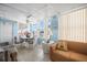 Bright living room with tile flooring, comfortable seating, and large windows offering natural light at 932 Cassandra Ln, Lakeland, FL 33809