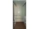 Open closet system featuring white metal shelving with wooden flooring at 2505 W Parker St, Lakeland, FL 33815