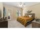Cozy bedroom filled with natural light through the windows and glass door at 504 Mirasol Cir # 102, Kissimmee, FL 34747