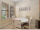 Comfortable dining area showcases light walls and flooring with large windows at 504 Mirasol Cir # 102, Kissimmee, FL 34747
