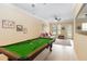 Spacious game room complete with a pool table and ample seating area at 504 Mirasol Cir # 102, Kissimmee, FL 34747
