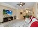 Inviting living room featuring a fireplace, mounted TV, pool table, and neutral decor at 504 Mirasol Cir # 102, Kissimmee, FL 34747