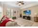 Relaxing living room featuring large windows, a ceiling fan, and cozy furniture at 504 Mirasol Cir # 102, Kissimmee, FL 34747