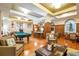 Lounge area with pool table, multiple seating areas, and ample room for activities at 504 Mirasol Cir # 102, Kissimmee, FL 34747